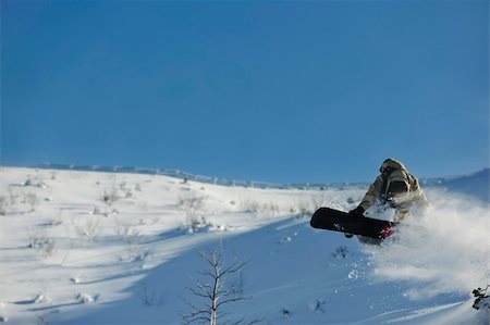 simsearch:400-05204614,k - freestyle snowboarder jump and ride free style  at sunny winter day on mountain Stock Photo - Budget Royalty-Free & Subscription, Code: 400-05204561