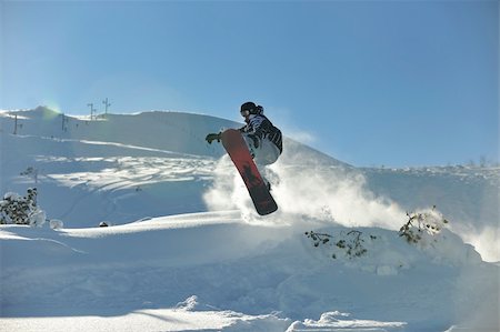 simsearch:400-05204614,k - freestyle snowboarder jump and ride free style  at sunny winter day on mountain Stock Photo - Budget Royalty-Free & Subscription, Code: 400-05204562