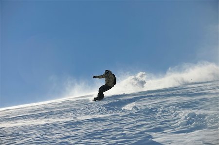 simsearch:400-04172843,k - freestyle snowboarder jump and ride free style  at sunny winter day on mountain Stock Photo - Budget Royalty-Free & Subscription, Code: 400-05204592