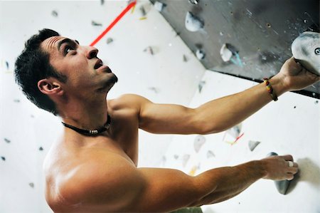 young and fit man exercise free mountain climbing on indoor practice wall Stock Photo - Budget Royalty-Free & Subscription, Code: 400-05204695