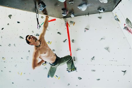 young and fit man exercise free mountain climbing on indoor practice wall Stock Photo - Budget Royalty-Free & Subscription, Code: 400-05204697