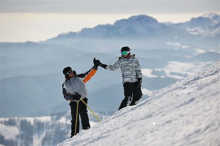 simsearch:400-04256964,k - happy couple drivingand relaxing with snowboard and ski at winter seasson on mountain Stock Photo - Budget Royalty-Free & Subscription, Code: 400-05204717