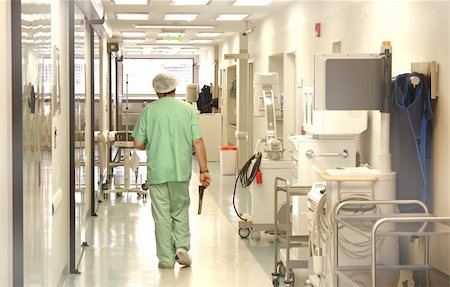 erdosain (artist) - Doctor using srubs walking at the hospital corridor Stock Photo - Budget Royalty-Free & Subscription, Code: 400-05204945