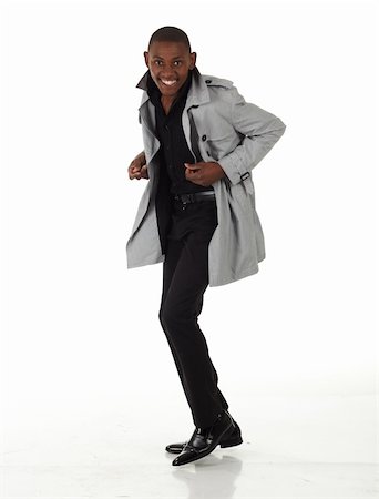 dance coat - Young black african businessman in a formal suite and grey jacket and on a white background - NOT ISOLATED Photographie de stock - Aubaine LD & Abonnement, Code: 400-05205059