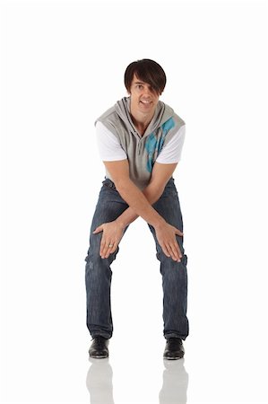 Single Caucasian male tap dancer wearing jeans showing various steps in studio with white background and reflective floor. Not isolated Stock Photo - Budget Royalty-Free & Subscription, Code: 400-05205170