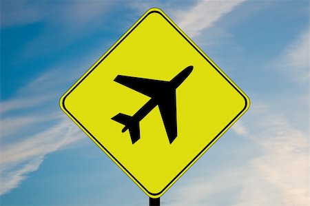 A caution sign with picture of airplane. Foto de stock - Super Valor sin royalties y Suscripción, Código: 400-05205664
