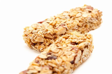 Two Nutritious Granola Bars Isolated on White with narrow Depth of Field. Stock Photo - Budget Royalty-Free & Subscription, Code: 400-05205750