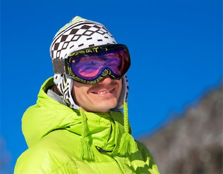 Young man wearing ski mask and sport jacket. Winter vacation in Alps Stock Photo - Budget Royalty-Free & Subscription, Code: 400-05206324