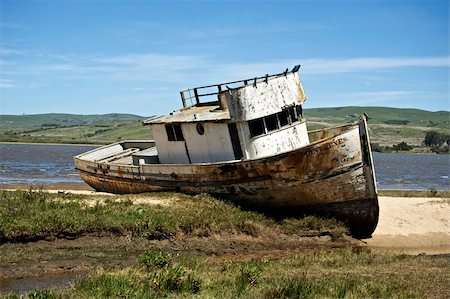 A circa 1930 Fishing Boat has been beached and abandoned on a northern California beach. Stock Photo - Budget Royalty-Free & Subscription, Code: 400-05207004