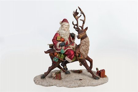 Statuette of Santa Klaus on isolated background Stock Photo - Budget Royalty-Free & Subscription, Code: 400-05208374