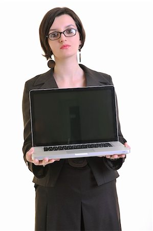 one young business woman isolated on white working on laptop computer Stock Photo - Budget Royalty-Free & Subscription, Code: 400-05209692