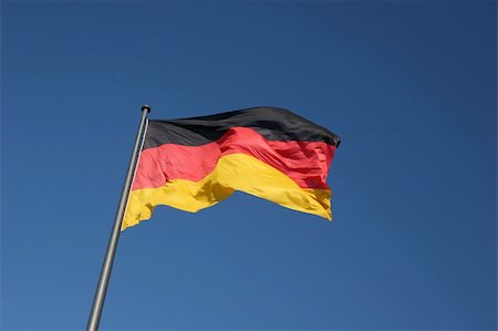simsearch:400-06085124,k - German national flag, the picture was made at the Reichstag in Berlin Stock Photo - Budget Royalty-Free & Subscription, Code: 400-05209946