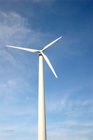 simsearch:400-04339274,k - White wind turbine in front of blue sky Fotografie stock - Microstock e Abbonamento, Codice: 400-05209965