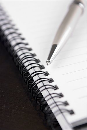 financial meeting tablet - Closeup of a notebook and a ballpoint pen Stock Photo - Budget Royalty-Free & Subscription, Code: 400-05200227