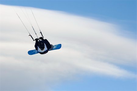 kiter with a snowboart flying on clouds Stock Photo - Budget Royalty-Free & Subscription, Code: 400-05200221