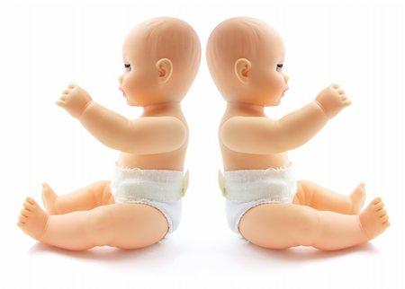 Plastic Baby Dolls on Isolated White Background Stock Photo - Budget Royalty-Free & Subscription, Code: 400-05200910