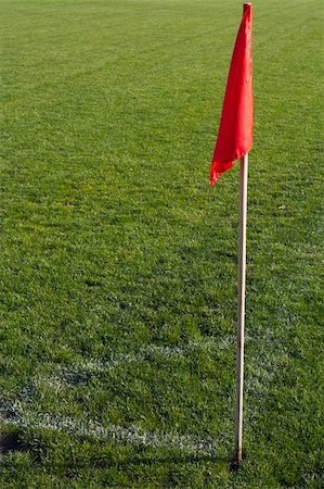 simsearch:400-06769903,k - Red corner flag on an soccer field. Photographie de stock - Aubaine LD & Abonnement, Code: 400-05202497