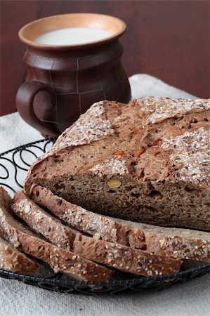 simsearch:859-06469950,k - Loaf of wholemeal bread with slices and milk Stock Photo - Budget Royalty-Free & Subscription, Code: 400-05203257