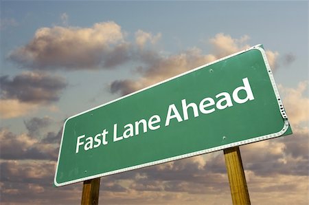 prime - Fast Lane Ahead Green Road Sign Over Dramatic Clouds and Sky. Stock Photo - Budget Royalty-Free & Subscription, Code: 400-05203514