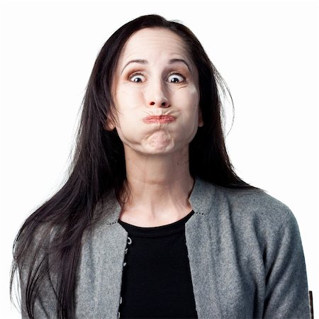 simsearch:400-05213670,k - Woman makes a funny face for the camera, isolated image Stock Photo - Budget Royalty-Free & Subscription, Code: 400-05214086