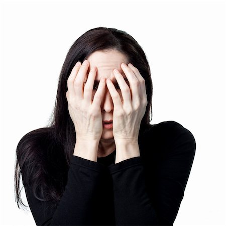 simsearch:400-05213670,k - Scared abused woman hiding behind her hands. Isolated image Stock Photo - Budget Royalty-Free & Subscription, Code: 400-05214096