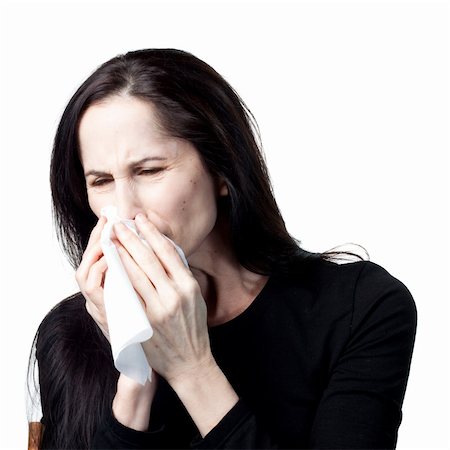 simsearch:400-05213670,k - Woman with allergies using a tissue, isolated image Stock Photo - Budget Royalty-Free & Subscription, Code: 400-05214097