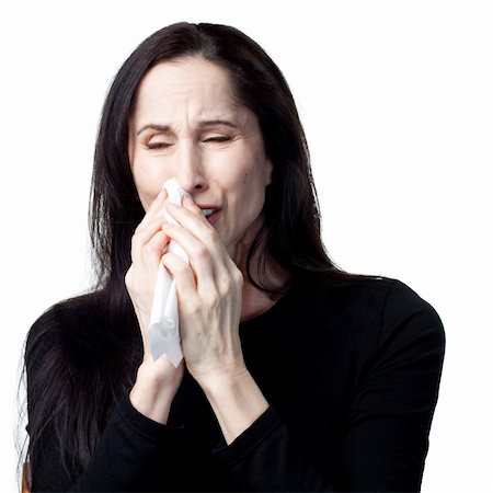 simsearch:400-05213670,k - Woman with allergies using a tissue, isolated image Stock Photo - Budget Royalty-Free & Subscription, Code: 400-05214099