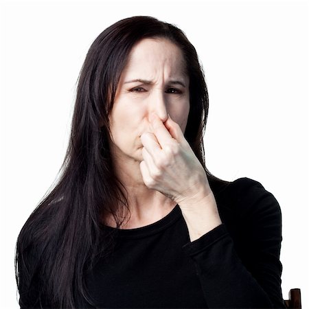 simsearch:400-05213670,k - Woman covers her nose, bad smells in the air Stock Photo - Budget Royalty-Free & Subscription, Code: 400-05214091