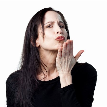 simsearch:400-05213670,k - Attractive older woman blowing a kiss, isolated image Stock Photo - Budget Royalty-Free & Subscription, Code: 400-05214103