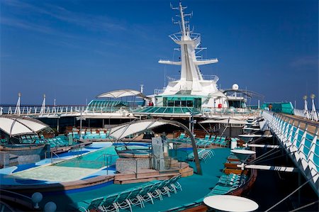 pool and cruise ship - Outdoor pool on top deck of cruise ship Stock Photo - Budget Royalty-Free & Subscription, Code: 400-05214173