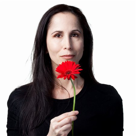 simsearch:400-05213670,k - Woman holding a red daisy, isolated studio image Stock Photo - Budget Royalty-Free & Subscription, Code: 400-05214277