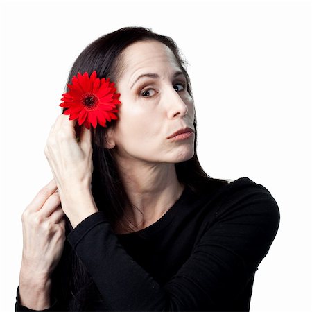 simsearch:400-05213670,k - Woman holding a red daisy, isolated studio image Stock Photo - Budget Royalty-Free & Subscription, Code: 400-05214278