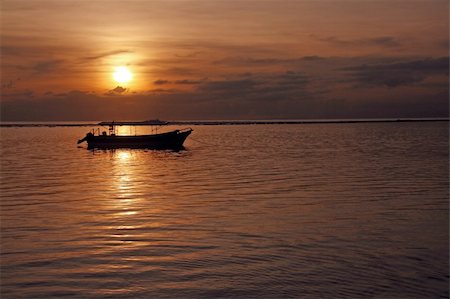 sanur - A fishing boat at Sanur Beach Bali Indonesia. Fotografie stock - Microstock e Abbonamento, Codice: 400-05214563