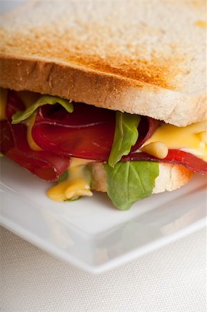 closeup of a ham sandwich with rocket salad Stock Photo - Budget Royalty-Free & Subscription, Code: 400-05215817