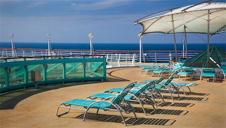deck chair railing - top deck of cruise ship Stock Photo - Budget Royalty-Free & Subscription, Code: 400-05215932