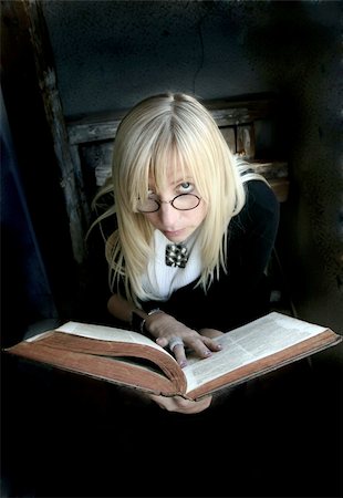 simsearch:400-04194599,k - Portrait of the beautiful blonde woman with glasses and old book Stock Photo - Budget Royalty-Free & Subscription, Code: 400-05216245