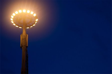 Big light pole against the blue sky at night Stock Photo - Budget Royalty-Free & Subscription, Code: 400-05216575