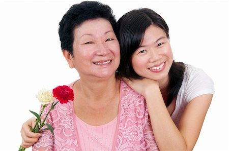 simsearch:400-04400433,k - Happy Asian Mother and Adult Daughter with carnation flower Stock Photo - Budget Royalty-Free & Subscription, Code: 400-05216806