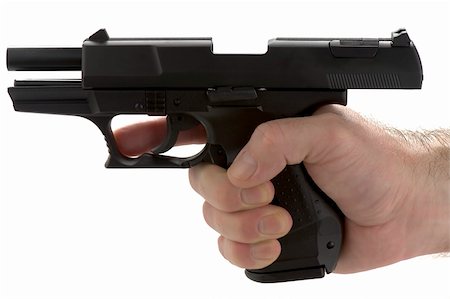 Black pistol, or handgun, held in a male adult's hand, with the slide locked back after emptying the clip. Empty magazine. Stockbilder - Microstock & Abonnement, Bildnummer: 400-05216841