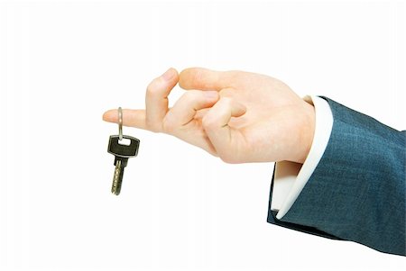 simsearch:400-04350998,k - hand holds a key isolated on white Stock Photo - Budget Royalty-Free & Subscription, Code: 400-05218400