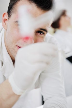 simsearch:400-06078063,k - young man scientist in chemistry bright lab Stock Photo - Budget Royalty-Free & Subscription, Code: 400-05218775