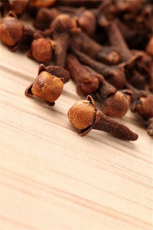 simsearch:400-04754857,k - Closeup of cloves on a wooden table. Shallow dof, selective focus Stock Photo - Budget Royalty-Free & Subscription, Code: 400-05218939