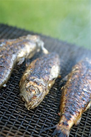Three trout on grill. Shallow dof, copy space Stock Photo - Budget Royalty-Free & Subscription, Code: 400-05210129