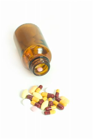 simsearch:400-08862116,k - pills spill out from bottle Stock Photo - Budget Royalty-Free & Subscription, Code: 400-05210905