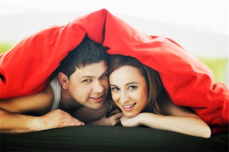 simsearch:400-04326193,k - happy young couple in bed at morning Stock Photo - Budget Royalty-Free & Subscription, Code: 400-05211321