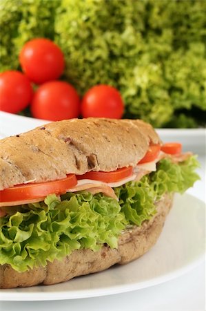 Ham and cheese sandwich with tomatoes and lettuce Photographie de stock - Aubaine LD & Abonnement, Code: 400-05211408