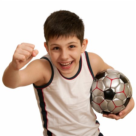 A running teen holding his right fist up and with a football ball in his left hand; isolated on the white background Stock Photo - Budget Royalty-Free & Subscription, Code: 400-05211448