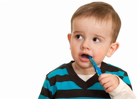 Kid is brushing his teeth; isolated on the white background Stock Photo - Budget Royalty-Free & Subscription, Code: 400-05211950