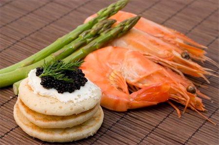 shrimp black - a finger food with caviar, shrimp and asparagus Stock Photo - Budget Royalty-Free & Subscription, Code: 400-05212818