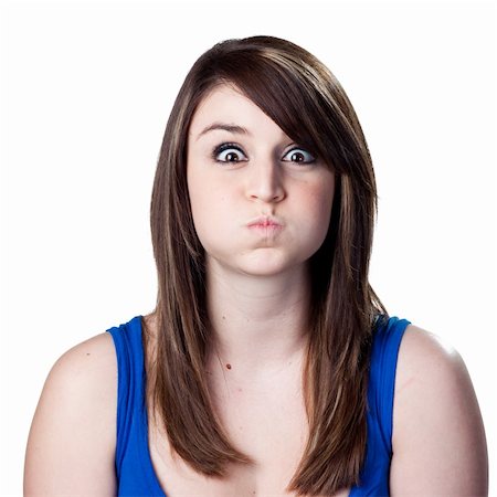 soplar velas - Young woman making a funny face Foto de stock - Super Valor sin royalties y Suscripción, Código: 400-05213181